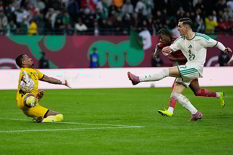 Algeria's Adil Boulbina fails to score in front of Sudan's goalkeeper Monged Elneel during the Africa Cup of Nations group E soccer match between Algeria and Sudan in Rabat, Morocco.