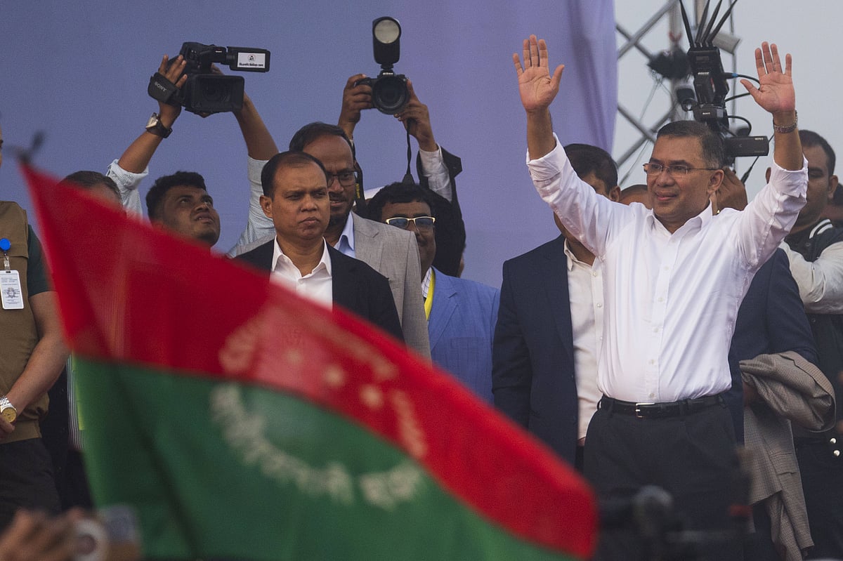 Tarique Rahman, son of former Prime Minister Khaleda Zia and a senior leader of the Bangladesh Nationalist Party (BNP), waves to supporters upon his arrival in Dhaka, Bangladesh on December 25, 2025. Rahman, widely seen as the party’s political heir and an aspiring prime minister, returned to Bangladesh after 17 years in self-imposed exile. - IMAGO / Anadolu Agency