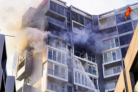 An apartment building stands gutted after a fire breaks out in the Argora residential area, in Ranchi.