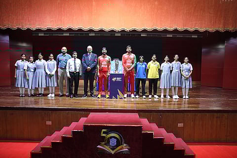 Students pose with the ICC Men’s T20 World Cup 2026 trophy alongside Oman captain Jatinder Singh at Indian School Muscat