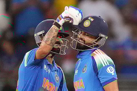 India's Shreyas Iyer, right, celebrates his half century with Virat Kohli during a One Day International (ODI) cricket match of the ICC Champions Trophy between India and Pakistan, at Dubai International Cricket Stadium, in Dubai, UAE, Sunday, Feb. 23, 2025. 