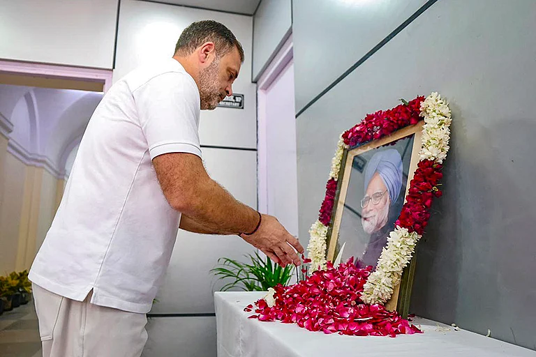 LoP in the Lok Sabha and Congress leader Rahul Gandhi pays tribute to former prime minister Manmohan Singh on his first death anniversary, in New Delhi. - | Photo: AICC via PTI