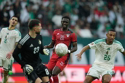 Sudan's Abo Eisa grimaces after failing to control the ball during the Africa Cup of Nations group E soccer match between Algeria and Sudan in Rabat, Morocco.