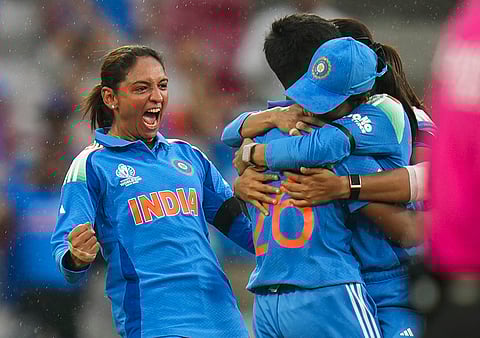 India's captain Harmanpreet Kaur and others celebrate the wicket of Australia's captain Alyssa Healy during an ICC Women's World Cup semifinal ODI cricket match between India Women and Australia Women, at the DY Patil Stadium, in Navi Mumbai, Thursday, Oct. 30, 2025. 