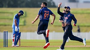 Photo: PTI : Virat Kohli, right, and Prince Yadav celebrate after Delhi won the Vijay Hazare Trophy 2025-26 match against Gujarat at BCCI Centre of Excellence in Bengaluru.