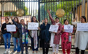| Photo: PTI/Salman Ali : Agitators, including women activists, hold placards as they stage a protest against the suspension of the jail term of Kuldeep Sengar, a former BJP MLA who was convicted in the Unnao rape case, outside the Delhi High Court, in New Delhi.