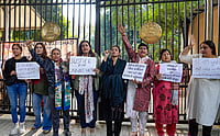 | Photo: PTI/Salman Ali : Agitators, including women activists, hold placards as they stage a protest against the suspension of the jail term of Kuldeep Sengar, a former BJP MLA who was convicted in the Unnao rape case, outside the Delhi High Court, in New Delhi.