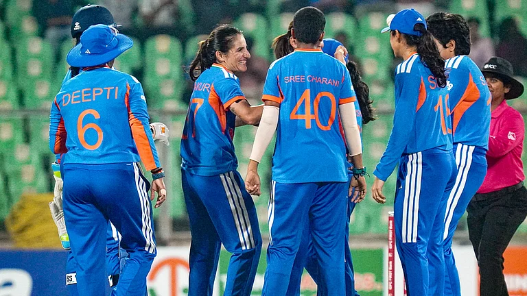 India's players celebrate a wicket during the third women's T20 International against Sri Lanka at Greenfield International Stadium in Thiruvananthapuram. - PTI