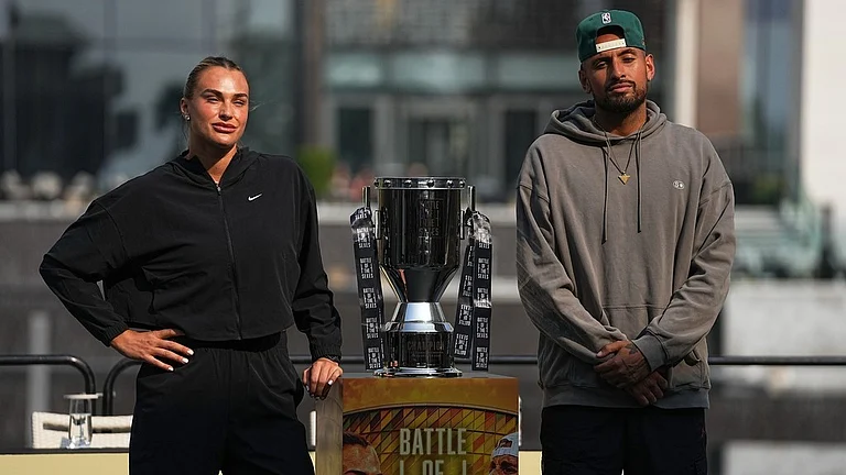 Aryna Sabalenka, left, and Nick Kyrgios pose with the trophy during a press conference ahead of the Battle of the Sexes exhibition match at Atlantis The Royal in Dubai, United Arab Emirates. - AP