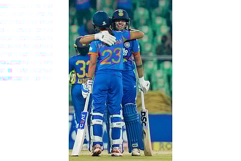 India's captain Harmanpreet Kaur with teammate Shafali Verma during the third T20 International cricket match of the series between India Women and Sri Lanka Women, at Greenfield International Stadium, in Thiruvananthapuram, Kerala.