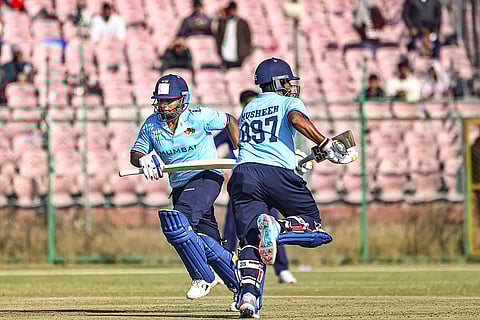 Mumbai's Sarfaraz Khan and Musheer Khan run between the wickets during the Vijay Hazare Trophy 2025-26 cricket match between Mumbai and Uttarakhand, at Sawai Mansingh Stadium, in Jaipur.