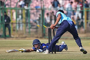 | Photo: PTI : Mumbai Onkar Tarmale dislodges the bails to run out Uttarakhand’s Aarav Mahajan during a Vijay Hazare Trophy 2025-26 cricket match between Mumbai and Uttarakhand, at Sawai Mansingh Stadium, in Jaipur, Rajasthan.