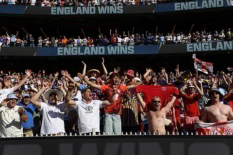 Fans celebrate England's win over Australia on Day 2 of their Ashes cricket test match in Melbourne.