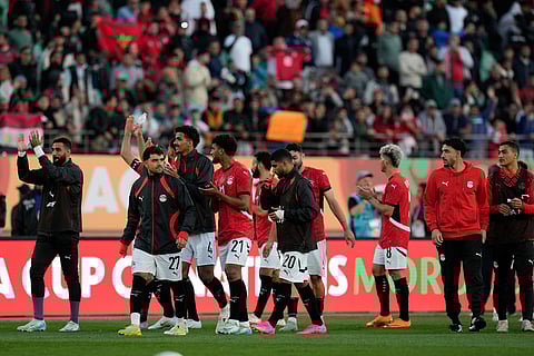 Egypt national team celebrate with the fans after winning the Africa Cup of Nations group B soccer match between Egypt and South Africa in Agadir, Morocco.