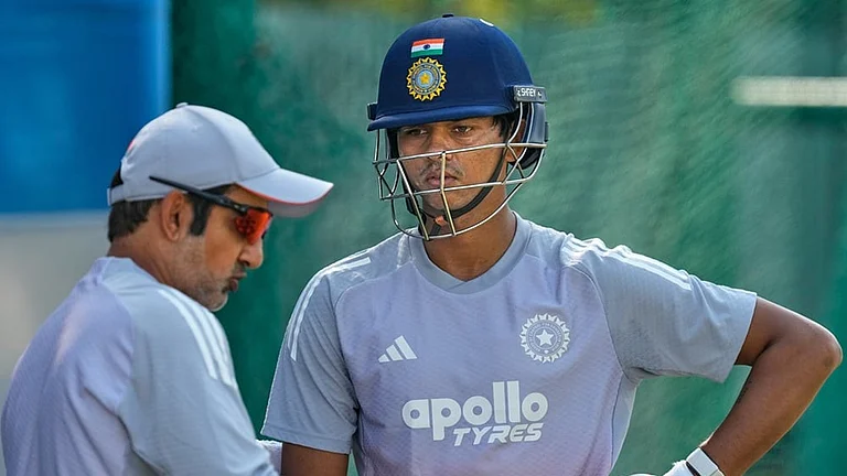 India's chief coach Gautam Gambhir, left, talks to Yashasvi Jaiswal during a practice session at net ahead of the second test match between India and South Africa in Guwahati. - | Photo: AP/Anupam Nath