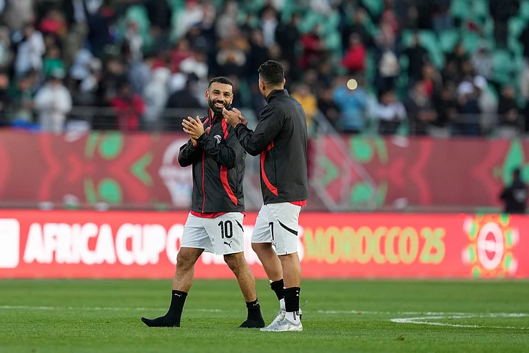 Egypt's Mohamed Salah and Egypt's Trézéguet celebrate after winning the Africa Cup of Nations group B soccer match between Egypt and South Africa in Agadir, Morocco. - | Photo: AP/Themba Hadebe