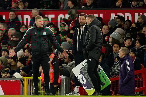 Newcastle's head coach Eddie Howe, left, during the English Premier League soccer match between Manchester United and Newcastle in Manchester, England.