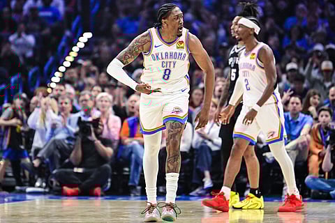 Oklahoma City Thunder Jalen Williams (8) gestures against the San Antonio Spurs during the first half of an NBA basketball game, in Oklahoma City.
