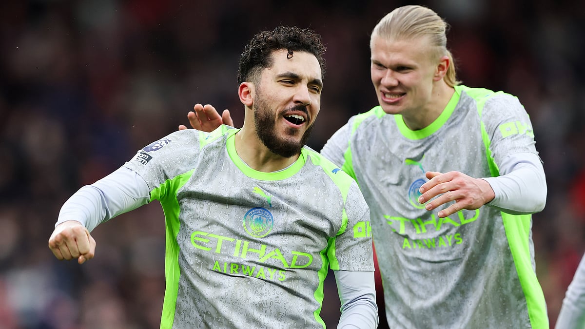 Manchester City's Rayan Cherki, left, celebrates with Erling Haaland after scoring his side's second goal during the Premier League match between Nottingham Forest and Manchester City, in Nottingham, England, Saturday Dec. 27, 2025 - (Barrington Coombs/PA via AP)