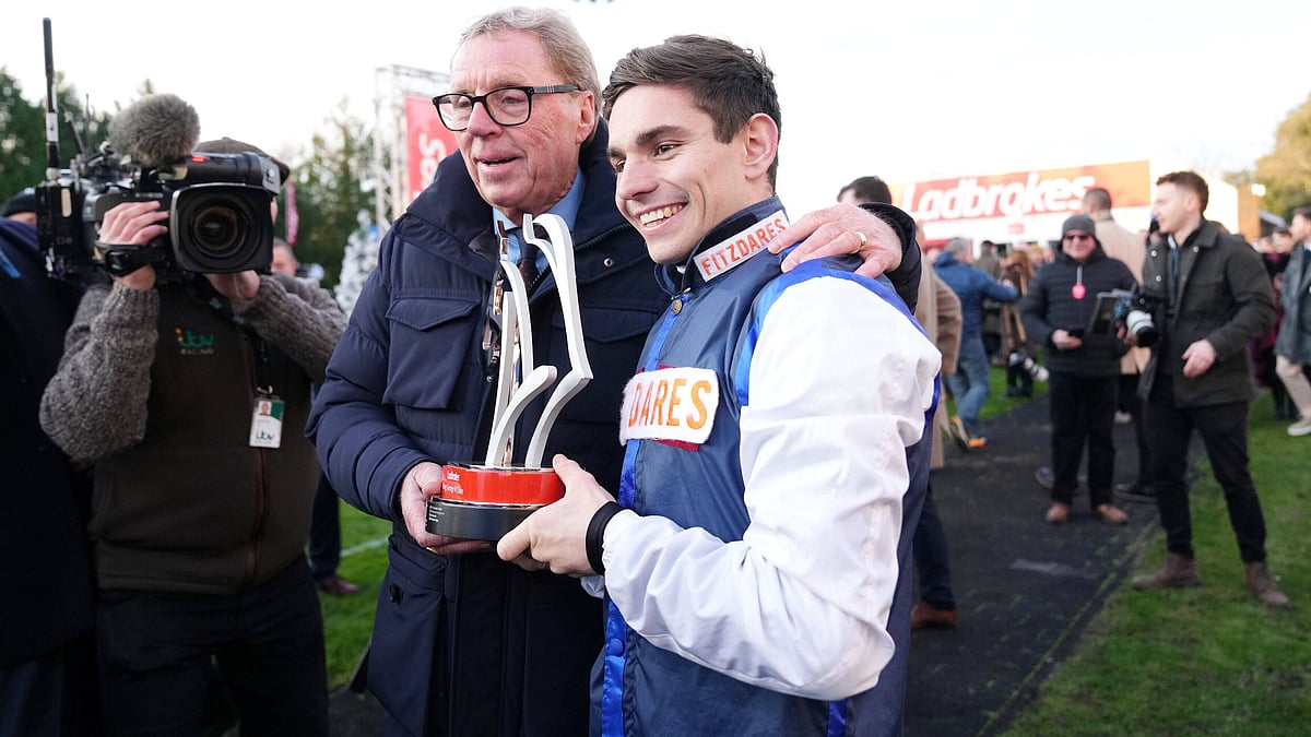 Ben Jones, right, celebrates with Harry Redknapp after The Jukebox Man wins the Ladbrokes King George VI Chase during day one of the Ladbrokes Christmas Festival at Kempton Park Racecourse, Sunbury-on-Thames, England, Friday Dec. 26, 2025. - | Photo: PA/John Walton via AP