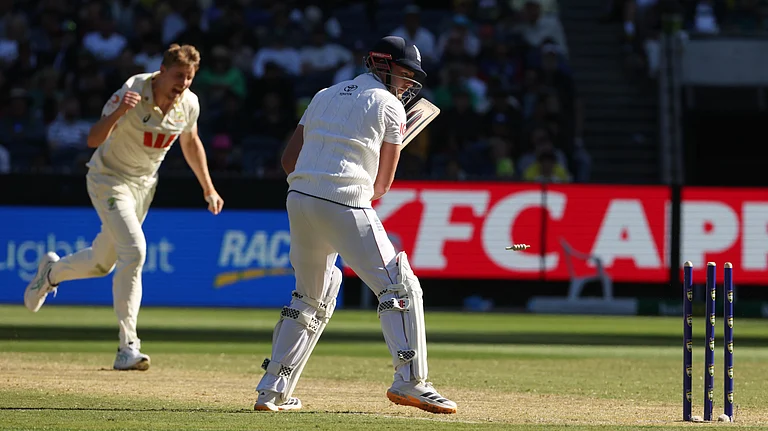 Australia's Cameron Green, left, celebrates after bowling England's Gus Atkinson, right, during their Ashes cricket test match in Melbourne, Friday, Dec. 26, 2025. - | Photo: AP/Hamish Blair