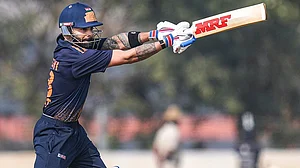 | Photo: PTI/Shailendra Bhojak : Delhi's Virat Kohli plays a shot during the Vijay Hazare Trophy 2025-26 cricket match between Gujarat and Delhi, at BCCI Centre of Excellence Ground, in Bengaluru.
