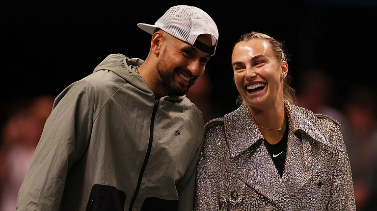 Aryna Sabalenka and Nick Kyrgios laugh ahead of their Battle of the Sexes tennis match in Dubai, United Arab Emirates, Sunday Dec. 28, 2025 - Amr Alfiky/Pool Photo via AP