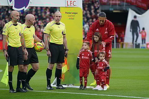 Two of Diogo Jota's three children, Dinis and Duarte, join the mascots at the first match between Liverpool and Wolves since the popular Portuguese was involved in a car accident with his brother, Andre Silva, in Liverpool.