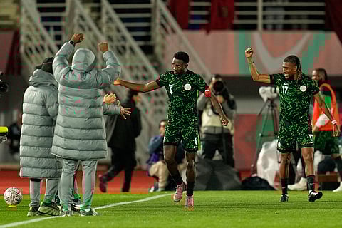 Nigeria's Wilfred Ndidi, center, celebrates with teammates after scoring his side's second goal during the Africa Cup of Nations group C soccer match between Nigeria and Tunisia in Fez, Morocco.