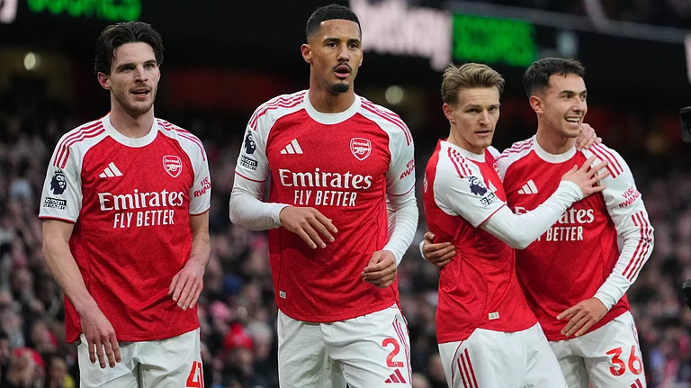 Arsenal's Declan Rice, William Saliba, scorer Martin Odegaard and Martin Zubimendi, from left, celebrate their opening goal during the English Premier League soccer match between Arsenal and Brighton and Hove Albion in London, Saturday, Dec. 27, 2025. - | Photo: AP/Kirsty Wigglesworth