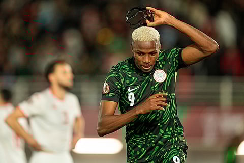 Nigeria's Victor Osimhen reacts after scoring his side's first goal during the Africa Cup of Nations group C soccer match between Nigeria and Tunisia in Fez, Morocco.