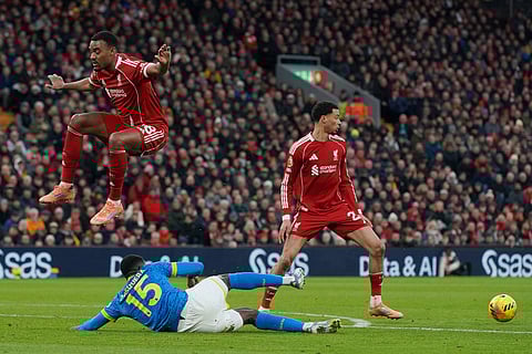 Liverpool's Ryan Gravenberch, top left, duels for the ball with Wolverhampton Wanderers' Yerson Mosquera during the English Premier League soccer match between Liverpool and Wolverhampton Wanderers in Liverpool.