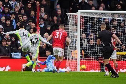 Manchester City's Tijjani Reijnders scores the opening goal during the Premier League match between Nottingham Forest and Manchester City, in Nottingham, England.