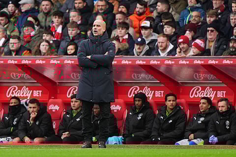 Manchester City manager Pep Guardiola gives instructions during the Premier League match between Nottingham Forest and Manchester City, in Nottingham, England.