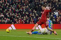 Liverpool 2-1 Wolves, EPL 2025-26: Florian Wirtz Helps Reds Notch Up Fourth Straight Win | Photo: AP/Ian Hodgson : Liverpool's Florian Wirtz scores his side's second goal during the English Premier League soccer match between Liverpool and Wolverhampton Wanderers in Liverpool.