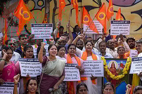Members of various Hindu organisations raise slogans during a protest condemning reported incidents of violence against Hindus in Bangladesh, in Bengaluru.