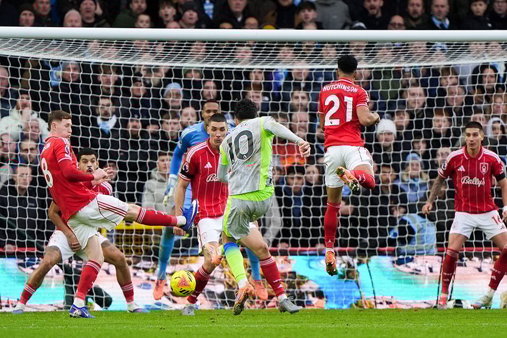 Manchester City's Rayan Cherki scores his side's second goal during the Premier League match between Nottingham Forest and Manchester City, in Nottingham, England. - | Photo: Joe Giddens/PA via AP