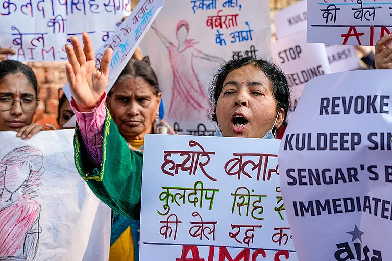 Members of various organisations raise slogans during a protest seeking justice for the Unnao rape case survivor, at Jantar Mantar in New Delhi. - | Photo: PTI/Atul Yadav