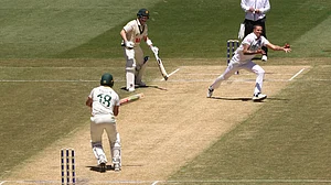 | Photo: AP/Hamish Blair : England's Brydon Carse, right, completes a caught and bowled on Australia's Michael Neser, left, on Day 2 of their Ashes cricket test match in Melbourne, Saturday, Dec. 27, 2025.