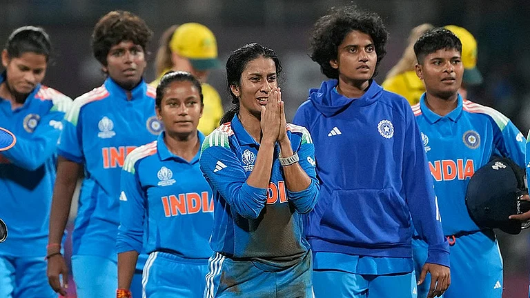 Jemimah Rodrigues, centre, reacts after helping India win the ICC Women's Cricket World Cup semi-final against Australia in Navi Mumbai. - AP