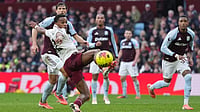Photo: AP/Dave Shopland : Arsenal's Jurrien Timber kicks the ball during the English Premier League soccer match between Aston Villa and Arsenal in Birmingham, England.