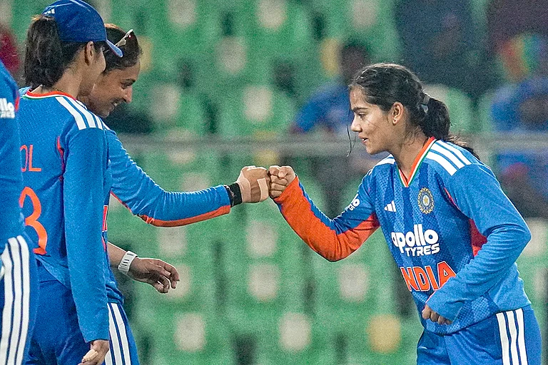 From left, India's Harleen Deol, captain Harmanpreet Kaur and Vaishnavi Sharma celebrate a wicket during the fourth T20 International cricket match of a series between India Women and Sri Lanka Women, at Greenfield International Stadium, in Thiruvananthapuram, Kerala. - | Photo: PTI