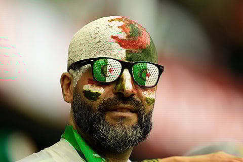 Algeria's fans wait for the start of the Africa Cup of Nations group E soccer match between Algeria and Burkina Faso in Fez, Morocco.