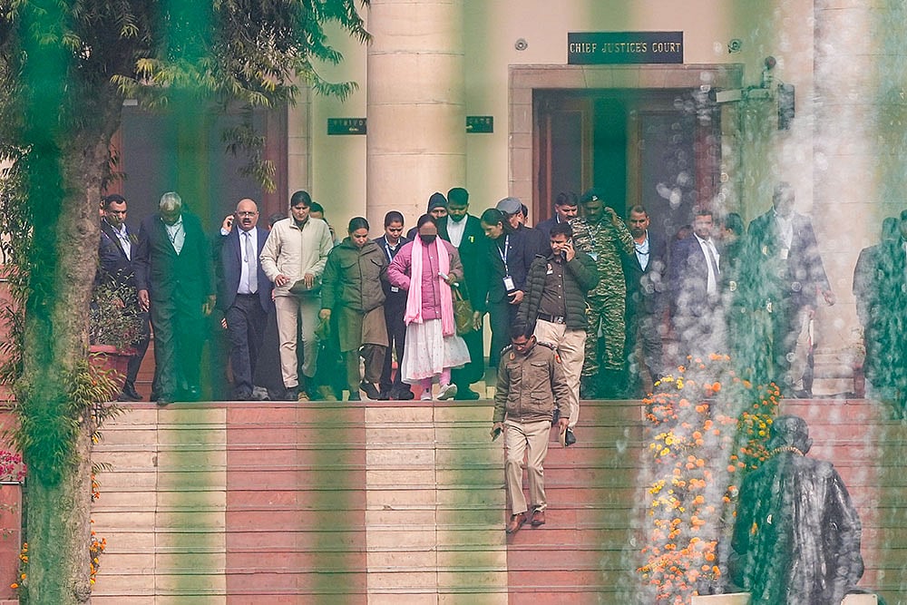 Victim in the Unnao rape case, centre, at Supreme Court in New Delhi. Supreme Court stayed the Delhi High Court's order suspending the life sentence of expelled BJP leader Kuldeep Singh Sengar in the 2017 Unnao rape case. - Photo: PTI/Ravi Choudhary