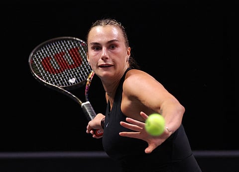 Aryna Sabalenka plays a forehand against Nick Kyrgios during their Battle of the Sexes tennis match, in Dubai, United Arab Emirates.