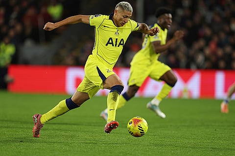 Tottenham's Richarlison controls the ball during the English Premier League soccer match between Crystal Palace and Tottenham Hotspur in London.