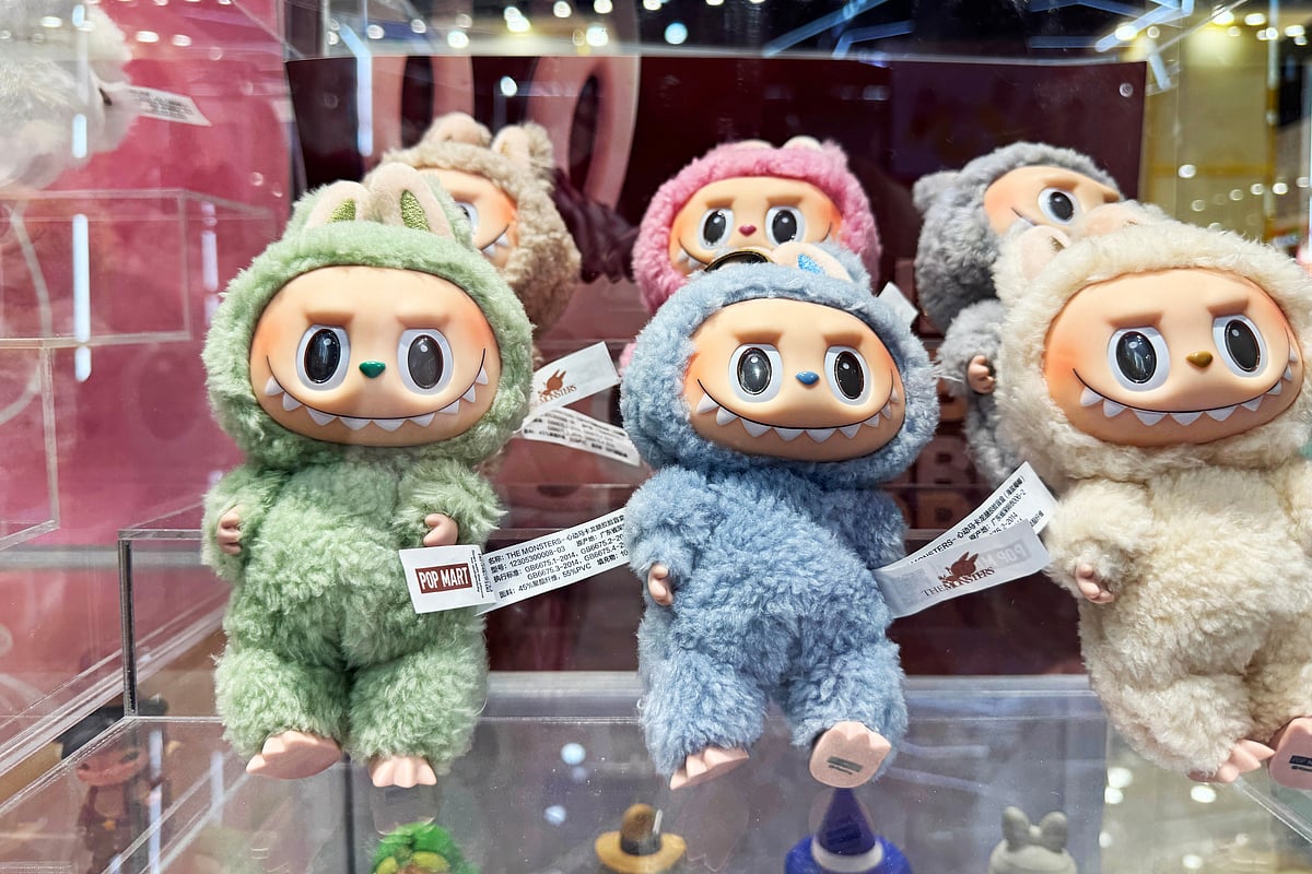 Labubu collectible toy from The Monsters by Pop Mart on display with surprise boxes. Popular designer art figure seen in stores, videos, TikTok, reels, shorts - Shutterstock 