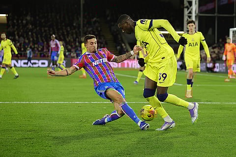 Tottenham's Randal Kolo Muani, centre right, and Crystal Palace's Yeremy Pino challenge for the ball during the English Premier League soccer match between Crystal Palace and Tottenham Hotspur in London.