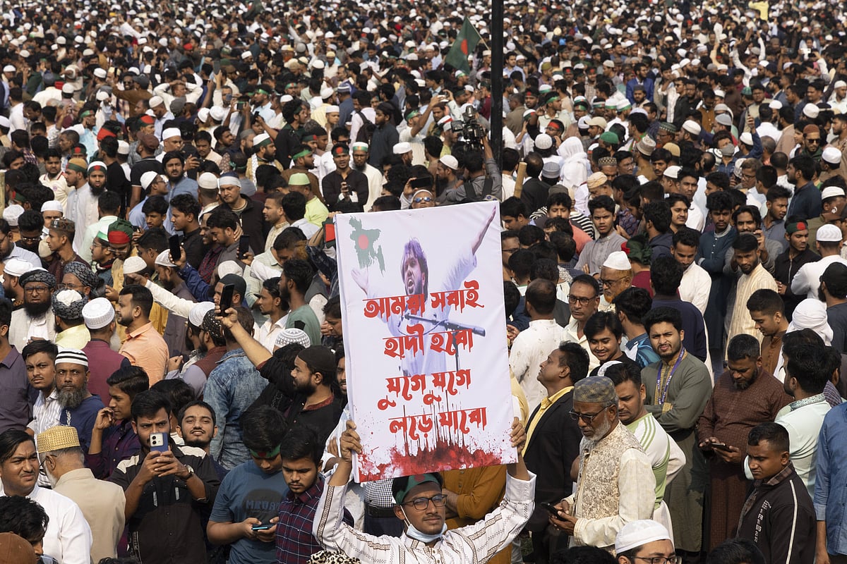 Sharif Osman Bin Hadi, a frontline leader of the July uprising and convener of the Inqilab Mancha, is laid to rest following a funeral prayer attended by hundreds of thousands at the South Plaza of the National Parliament Complex in Dhaka, Bangladesh, on December 20, 2025.  - IMAGO / Anadolu Agency 