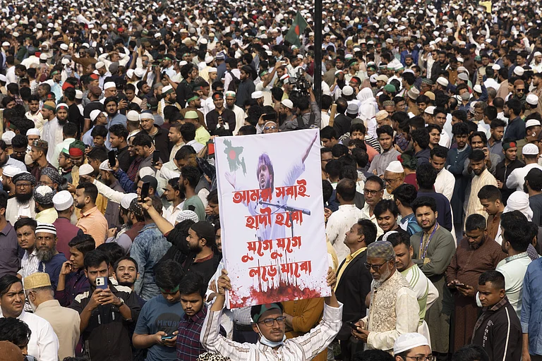 Sharif Osman Bin Hadi, a frontline leader of the July uprising and convener of the Inqilab Mancha, is laid to rest following a funeral prayer attended by hundreds of thousands at the South Plaza of the National Parliament Complex in Dhaka, Bangladesh, on December 20, 2025. - IMAGO / Anadolu Agency